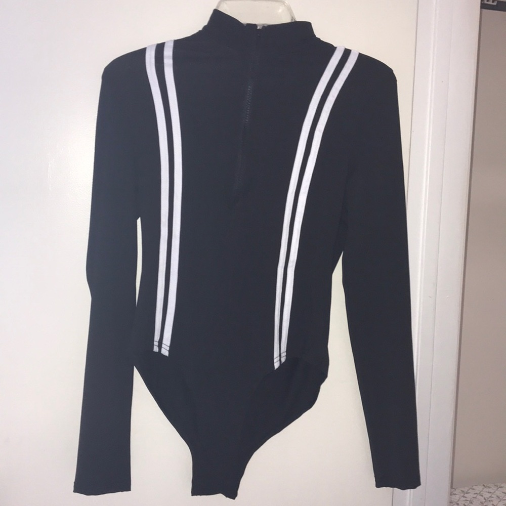 Black zippered body suit at the neck white stripes